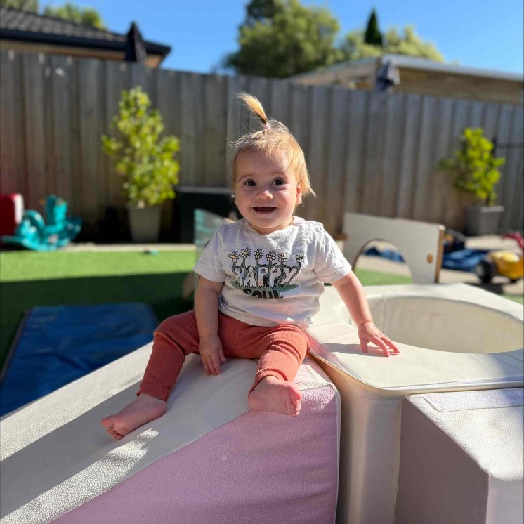 Baby girl in Nursery playrgound at Busy Bees Woodend