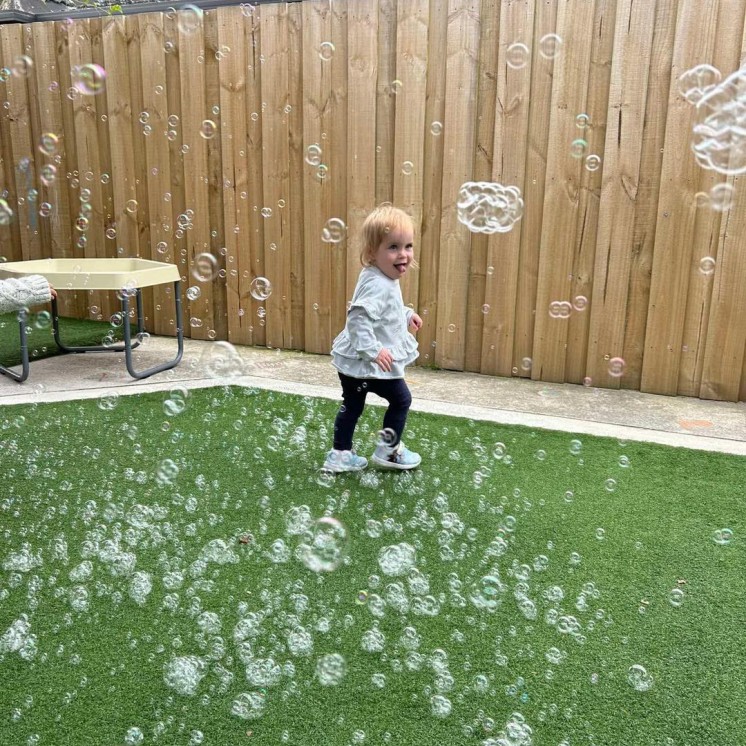 Busy Bees Woodend playing with bubbles