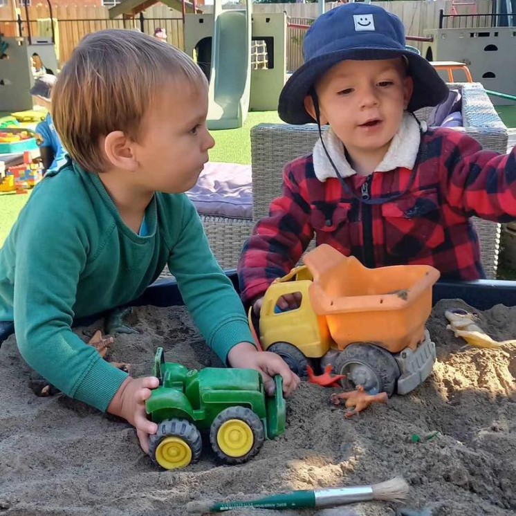 sand play with trucks at Busy Bees Woodend