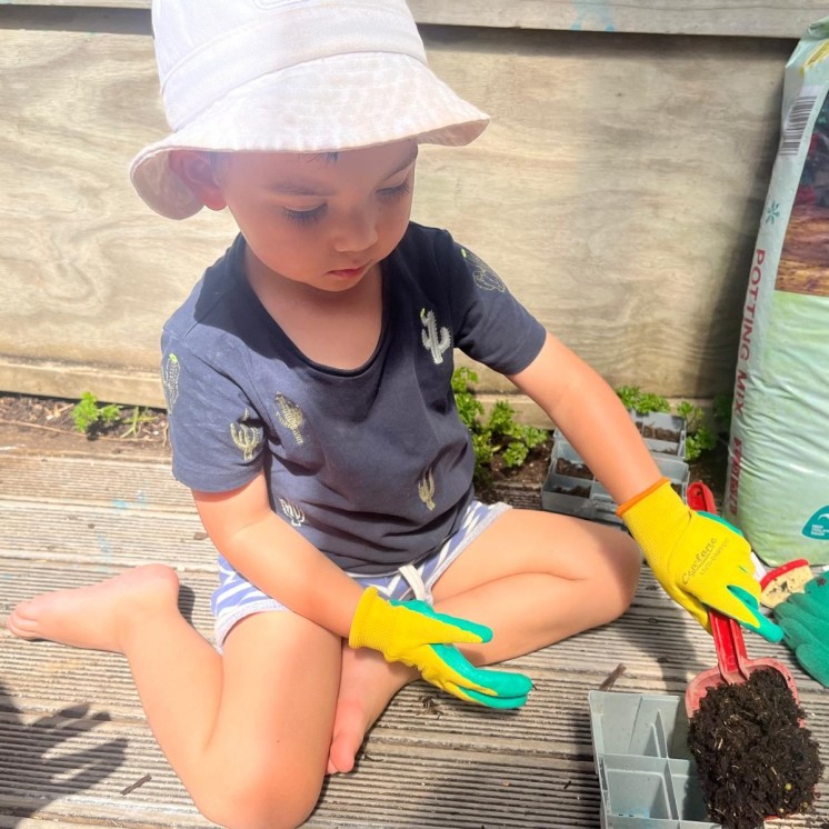 Gardening-planting plants at Grey Lynn Montessori by Busy Bees 
