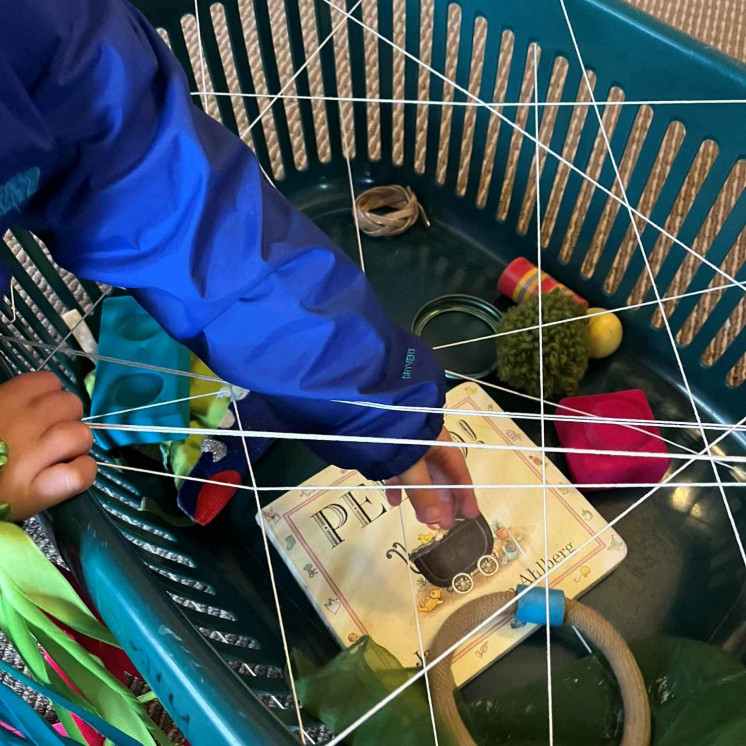 Curiosity in full swing with this spider web discovery basket at Blossom House Nursery, our under two year old centre at HardyKids Nelson.