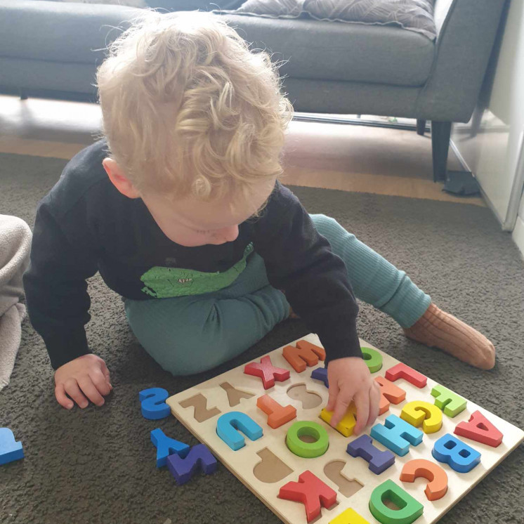 Preschool boy engaged in puzzle at House of Wonder Chartwell