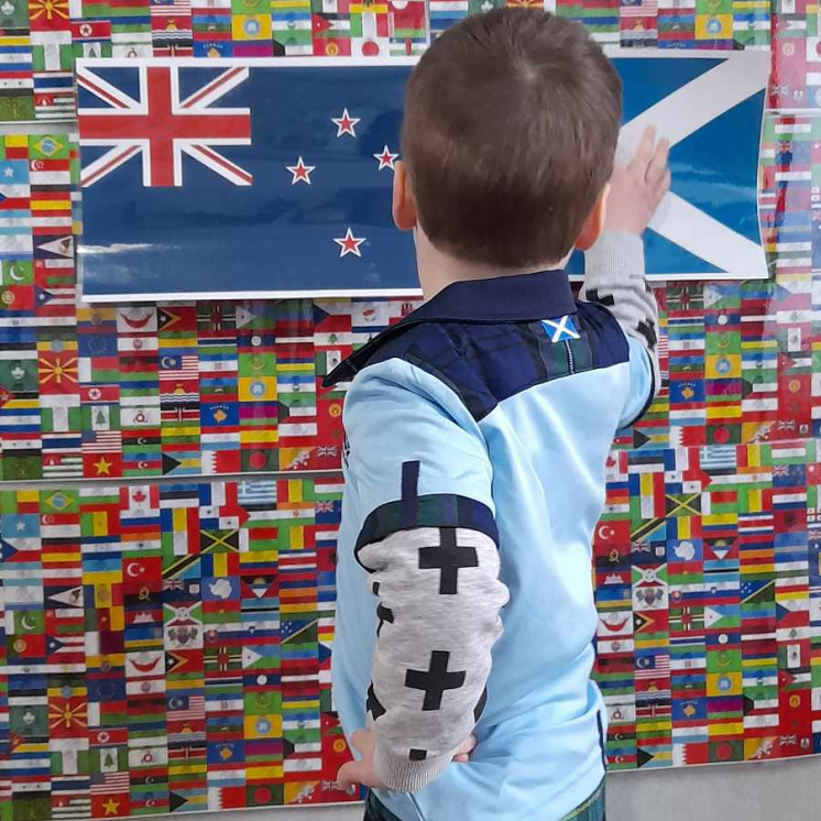 Preschool boy looking at world map at House of Wonder Chartwell