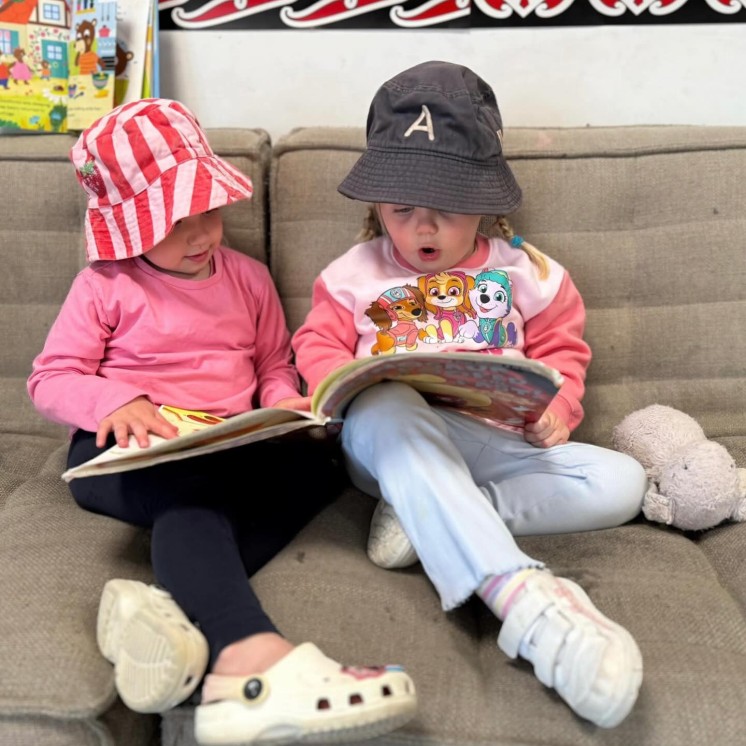 HOW Christchurch Grils reading a book