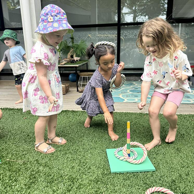 Little Coasties by Busy Bees Manly Whangaparaoa 3 girls quoits outside MOVE