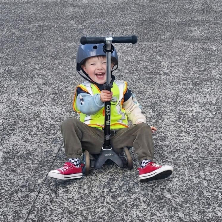 Little Coastie by Busy Bees Manly Whangaparaoa Boy with scooter big smile