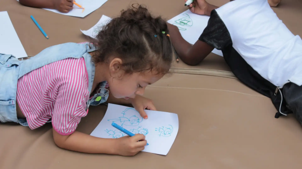 Social emotion learning resilience – A girl lying down and drawing